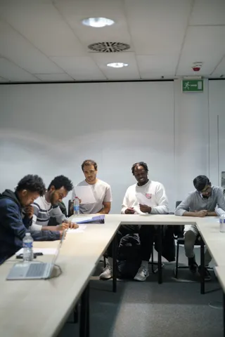 Participants around a U-shaped table at the Get Your Home workshop
