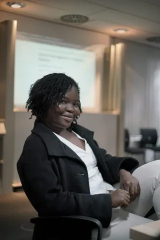A participant smiling at the camera during the Get Your Home workshop