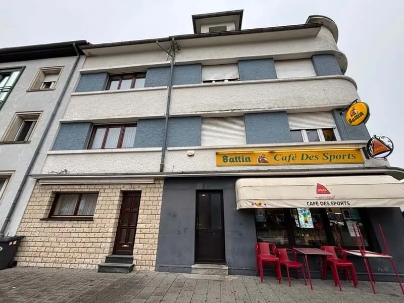 A YWS shared house in Luxembourg: a three-storey corner building with a café on the ground floor